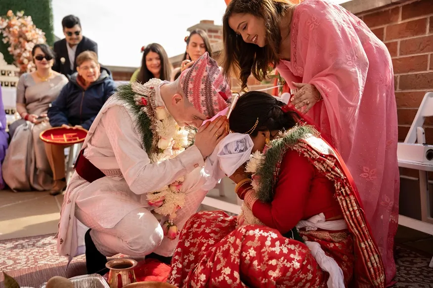 Bride and groom with family during traditional wedding photography style in Nepal